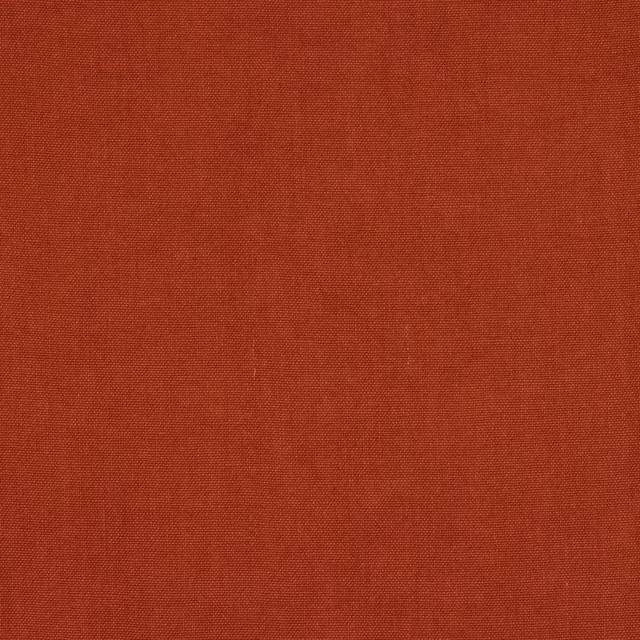 Terracotta plain-woven linen fabric swatch with fine matte texture