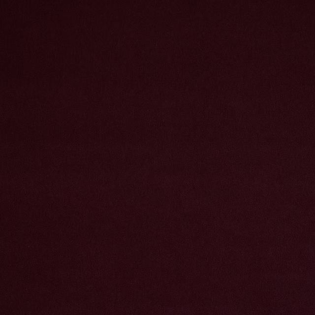 Deep plum-purple plain fabric swatch with a soft, velvety surface