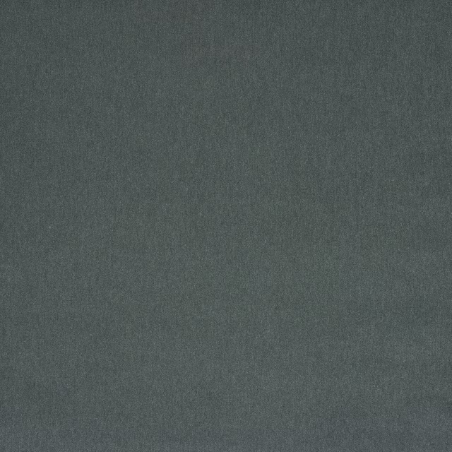 Close-up of a muted mineral teal plain woven fabric with a soft matte texture