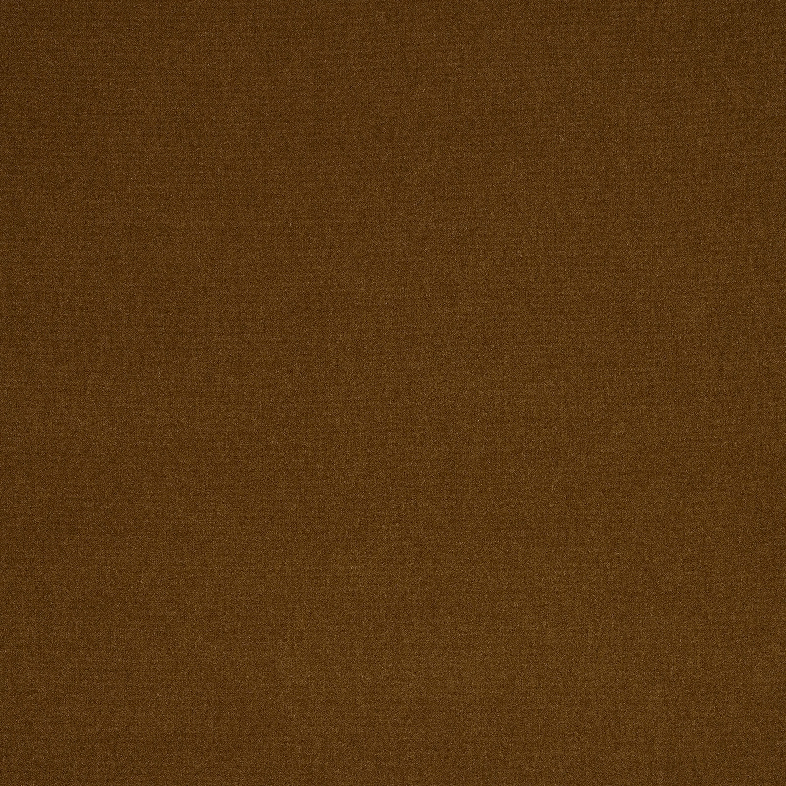 Close-up of a plain warm toffee-brown woven fabric with a soft nap