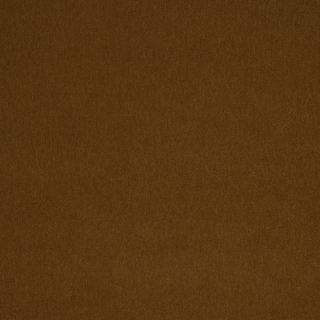 Close-up of a plain warm toffee-brown woven fabric with a soft nap