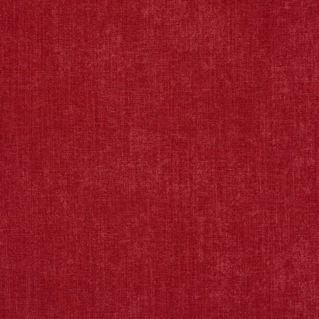 Close-up of soft muted red woven fabric with a fine matte texture