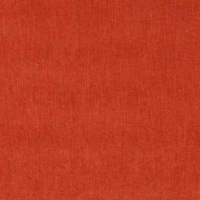 Close-up of warm burnt umber plain-woven fabric with fine textured grain
