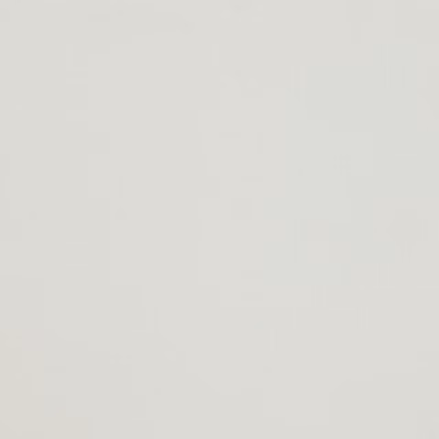 Soft warm white plain fabric swatch with a smooth even weave