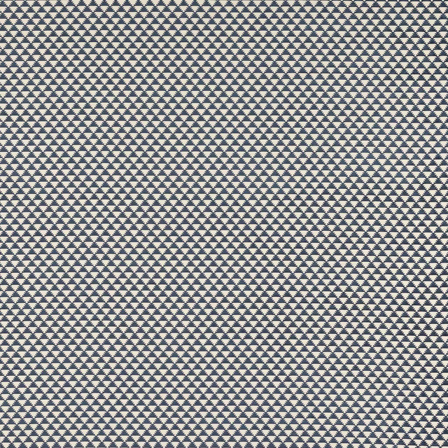 Close-up of indigo blue geometric woven fabric on a pale ground