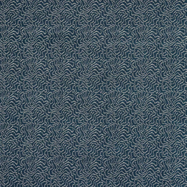 Blue abstract woven fabric with a small pale pattern on a cobalt ground