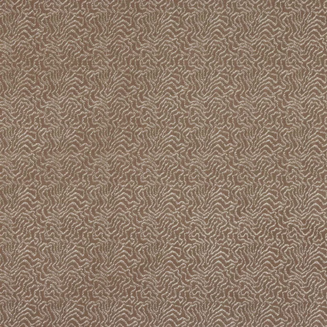 Taupe woven fabric with small abstract pale beige pattern and textured surface