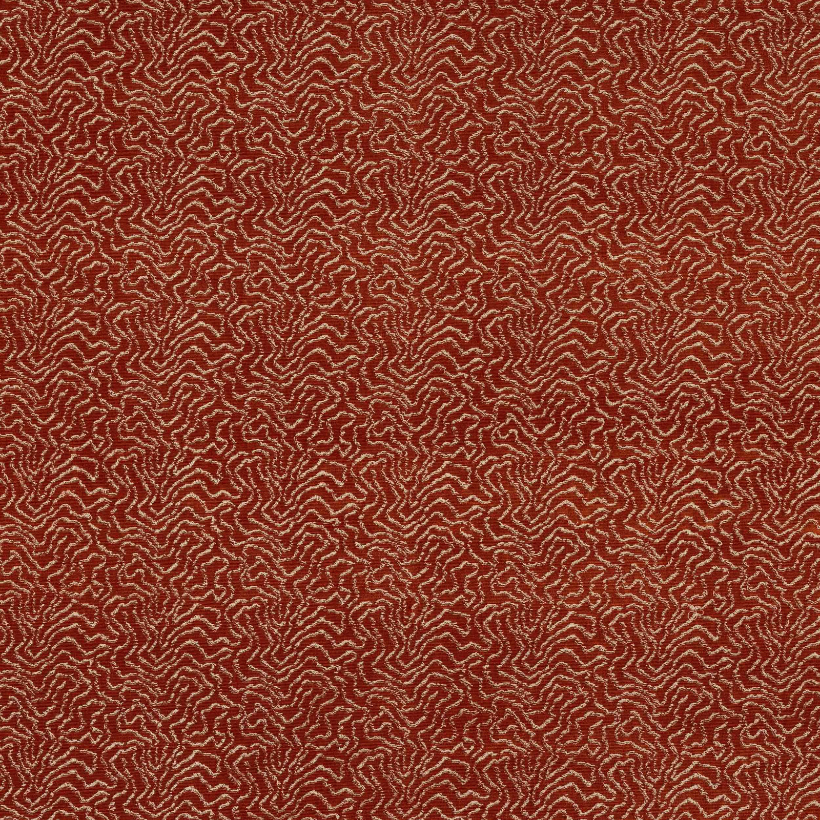 Warm terracotta fabric with a fine abstract maze-like pattern