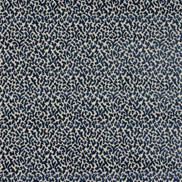 Close-up of small blue and ivory abstract woven pattern on fabric swatch