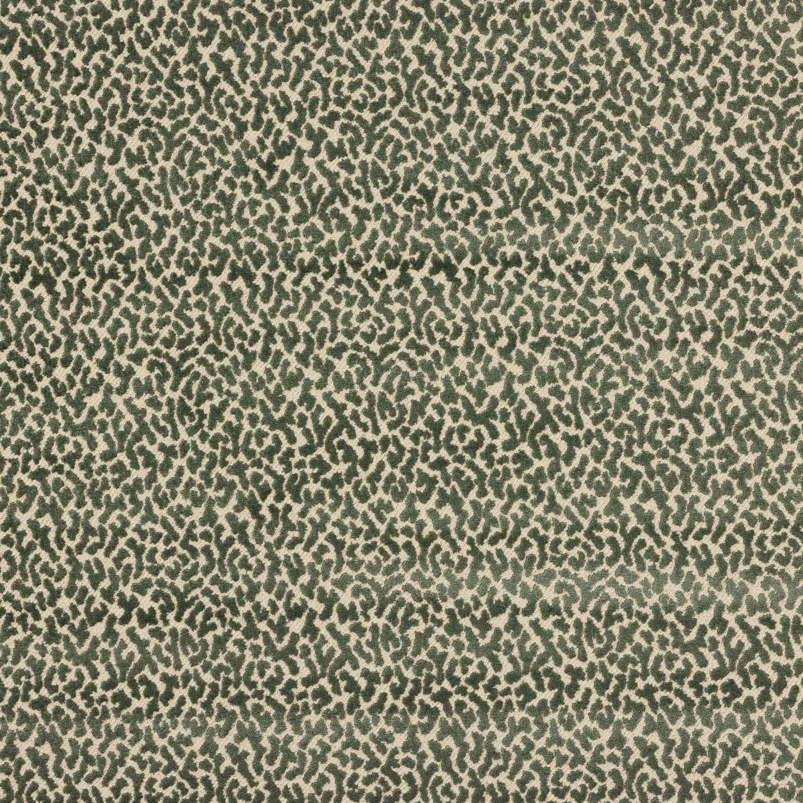 Close-up of small animal-print fabric in soft celadon and deep green