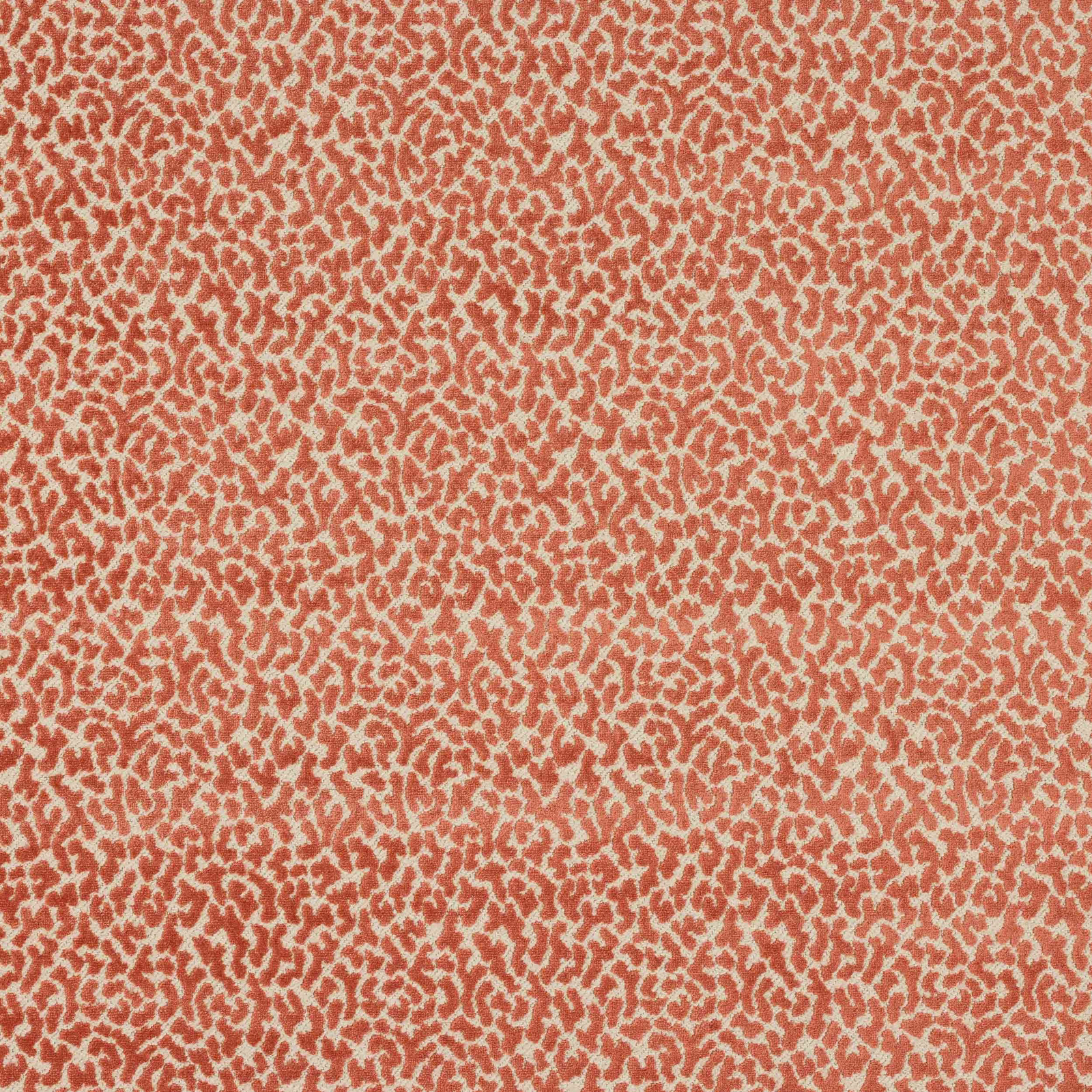Coral and peach small-scale textured pattern on woven fabric swatch