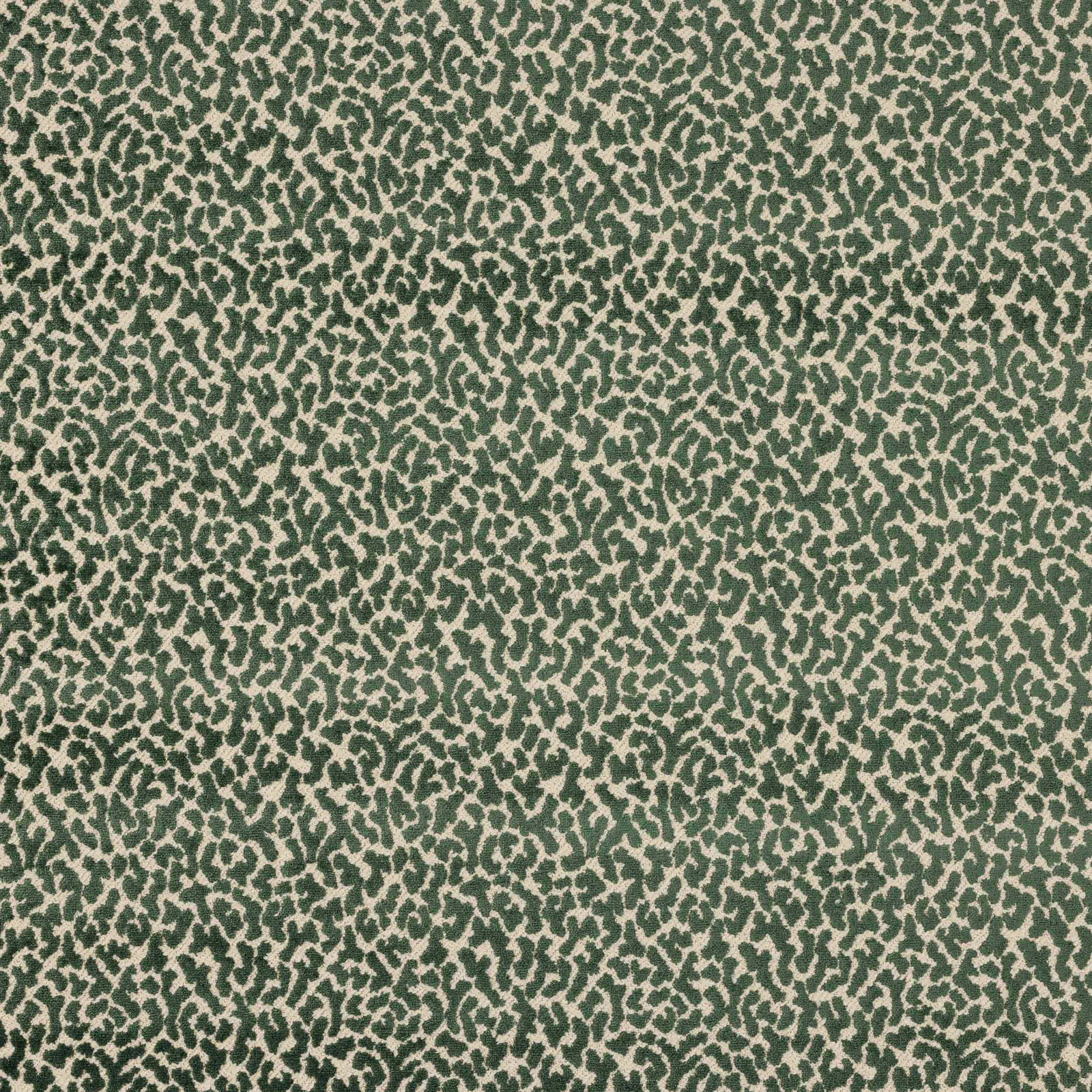 Close-up of green and beige small-scale animal print fabric swatch