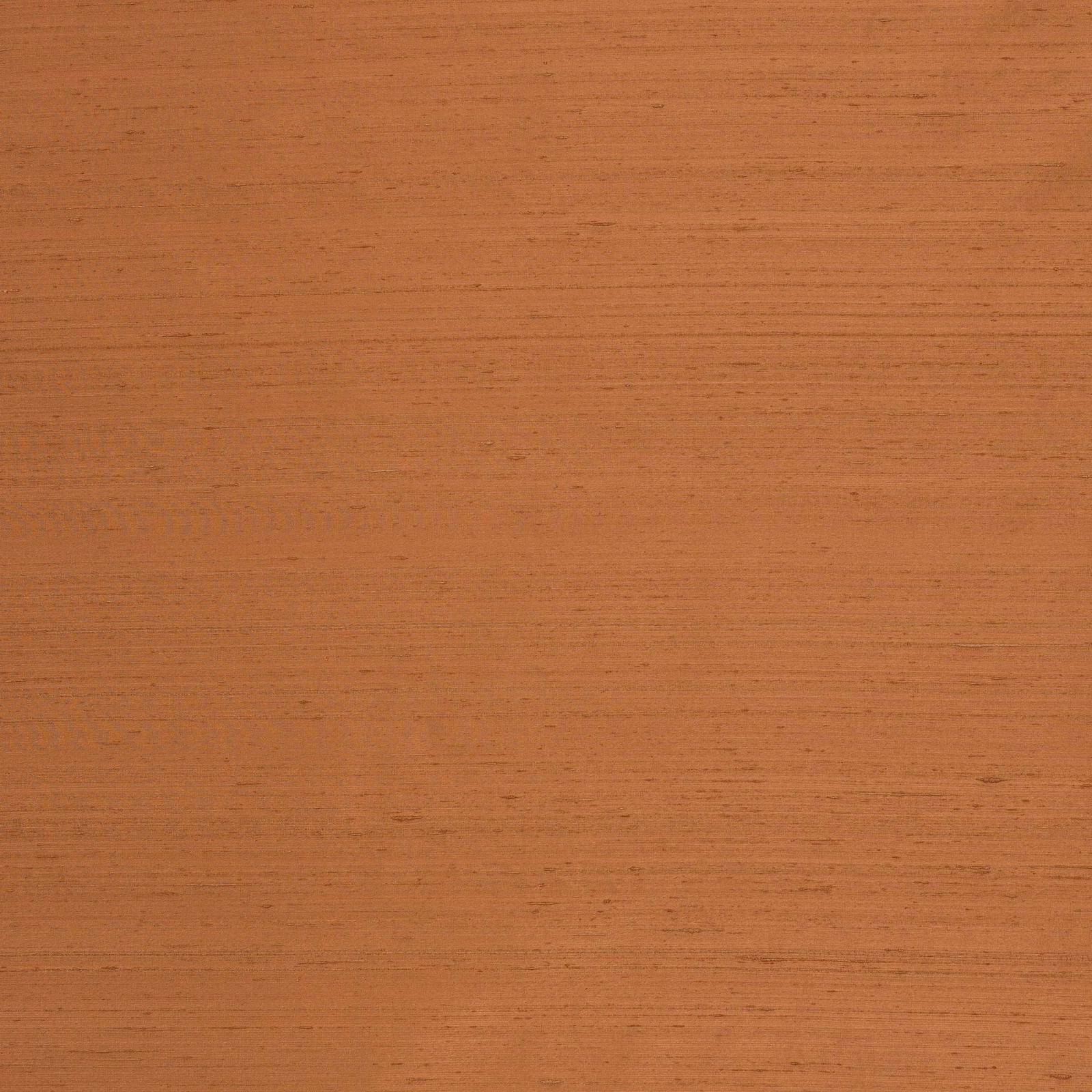 Burnt orange silk fabric with subtle horizontal striations and soft sheen