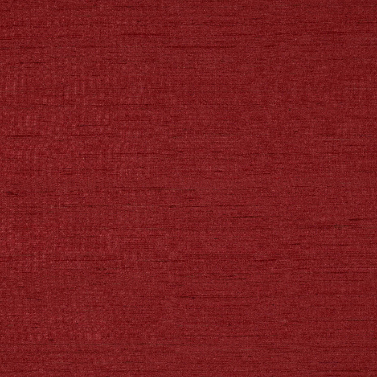 Deep red silk swatch with subtle horizontal slubs and a soft matte sheen