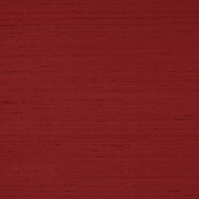 Deep red silk swatch with subtle horizontal slubs and a soft matte sheen