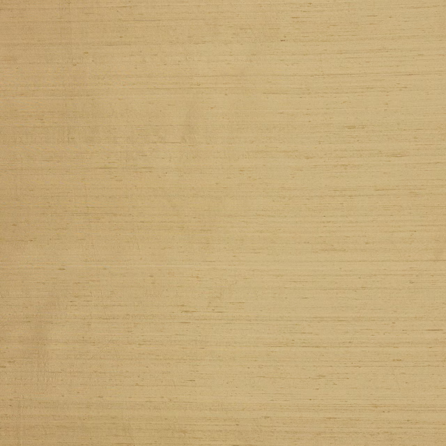 Close-up of soft straw-gold silk with fine horizontal slubs and subtle sheen