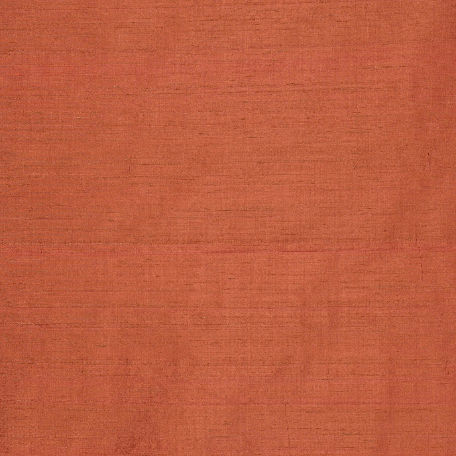 Warm tomato-orange silk swatch with fine horizontal slub texture