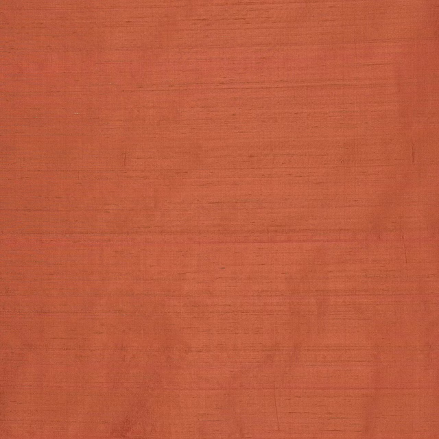 Warm tomato-orange silk swatch with fine horizontal slub texture