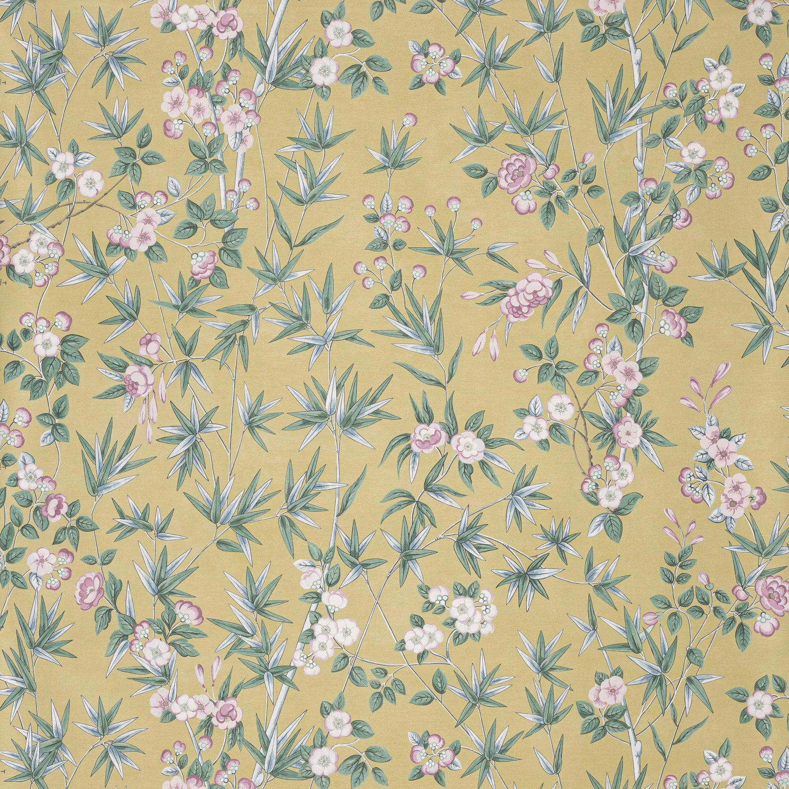 Ochre-gold botanical wallpaper with blue-green leaves and pink-white floral sprays