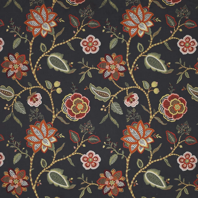 Dark charcoal floral fabric with embroidered-style red, green and ochre motifs