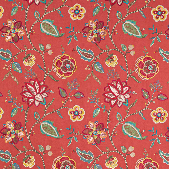 Coral red botanical fabric with large multicoloured flowers and winding vine stems