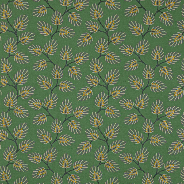 Leafy green botanical fabric with small ivory and gold sprays on a textured ground