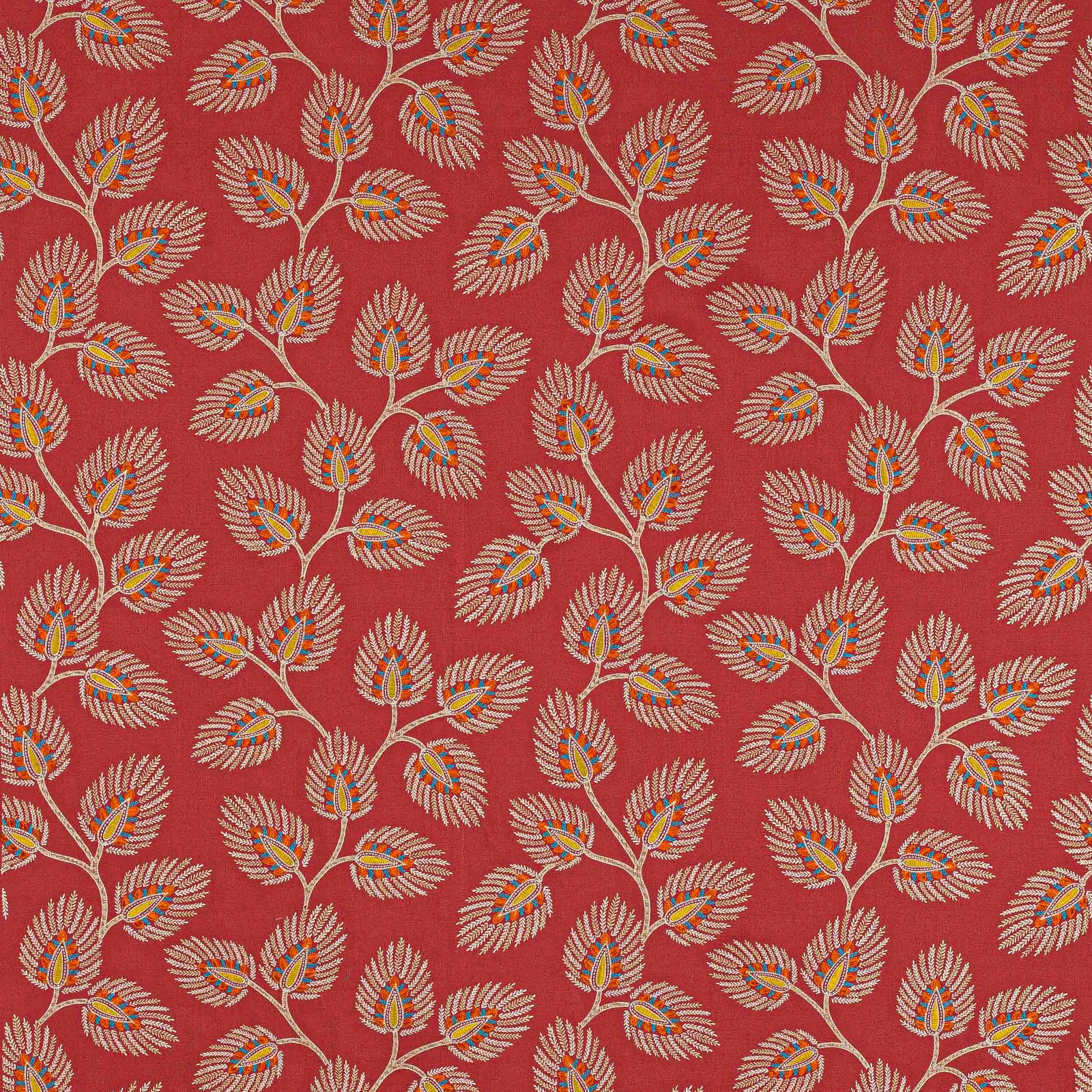 Red botanical fabric with repeating leaf sprigs in cream, orange and teal accents