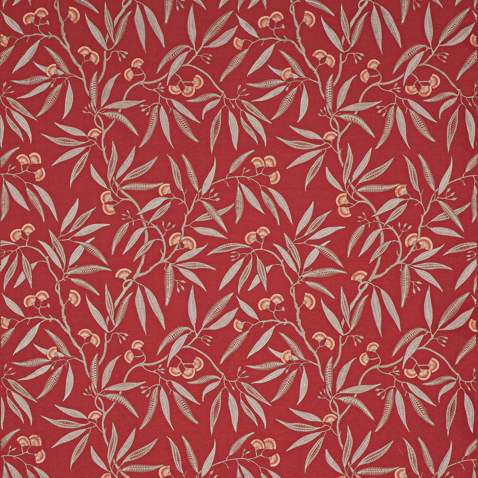 Red botanical patterned fabric with pale leaf and blossom motifs