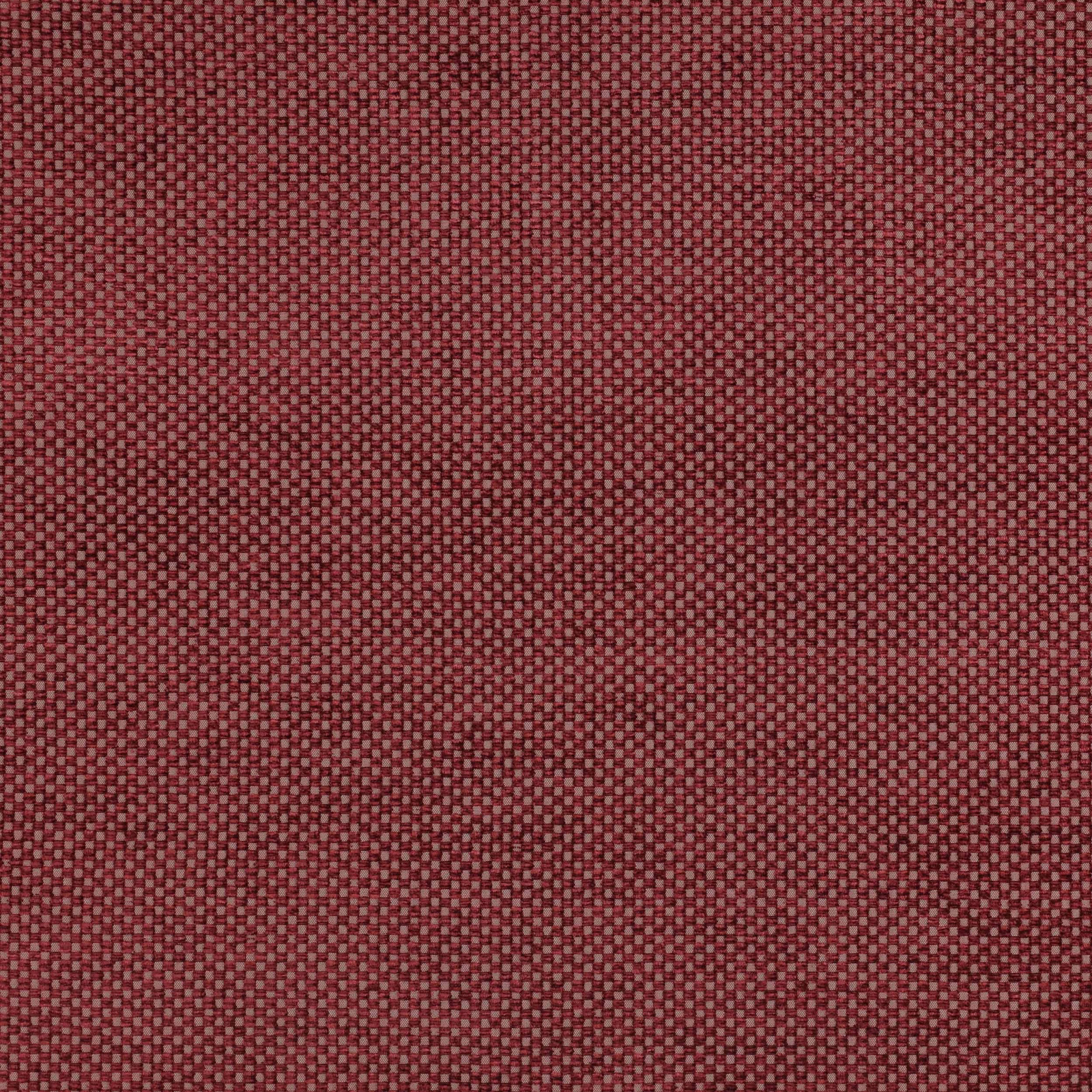 Close-up of muted brick red woven fabric with tiny checkerboard texture