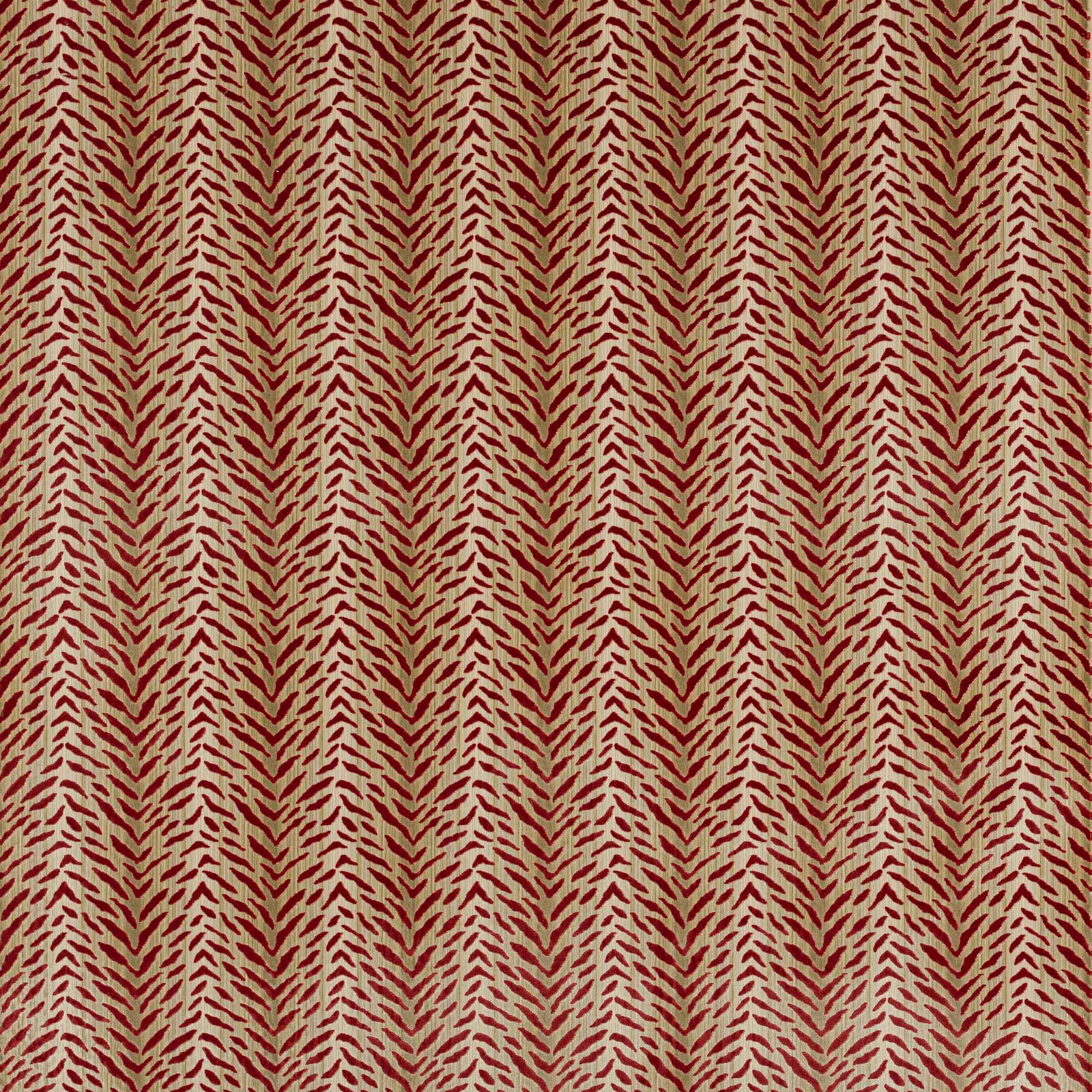 Close-up of Tigre Red patterned fabric with small red chevrons on a pale ground
