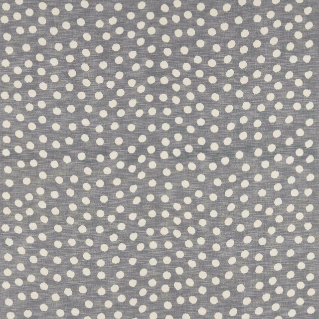 Grey cotton fabric with small cream polka dots and a dry woven texture