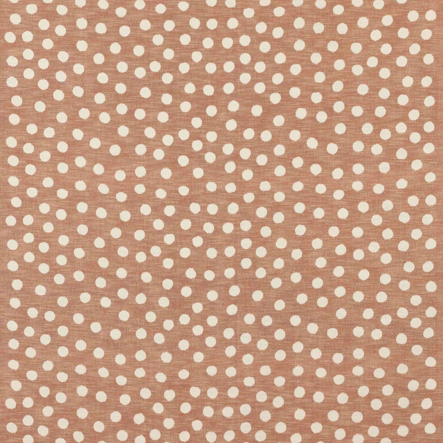 Dusty rose cotton fabric with small ivory polka dots and a subtle woven texture