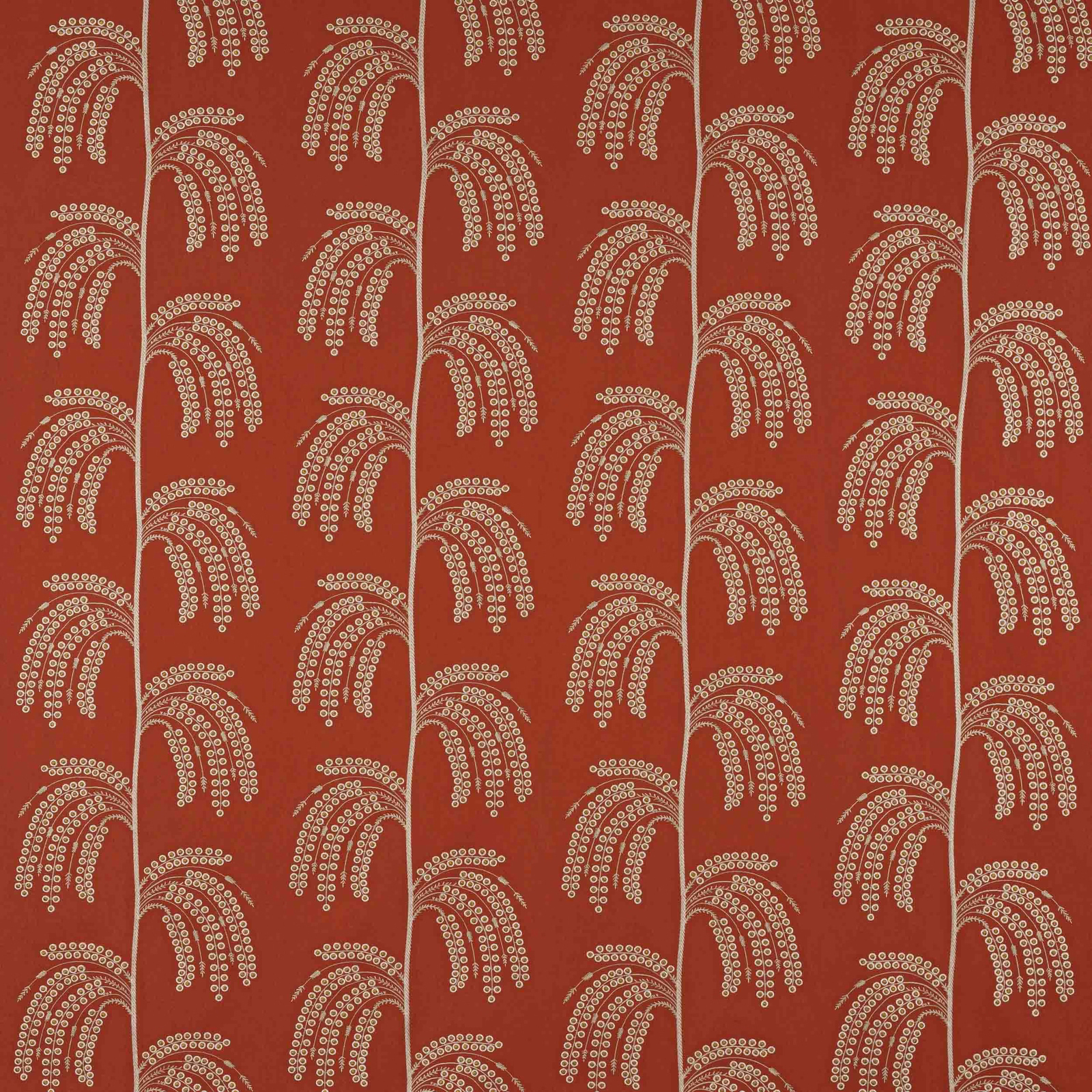 Paprika red-orange woven fabric with repeating arcing old-gold dotted motifs