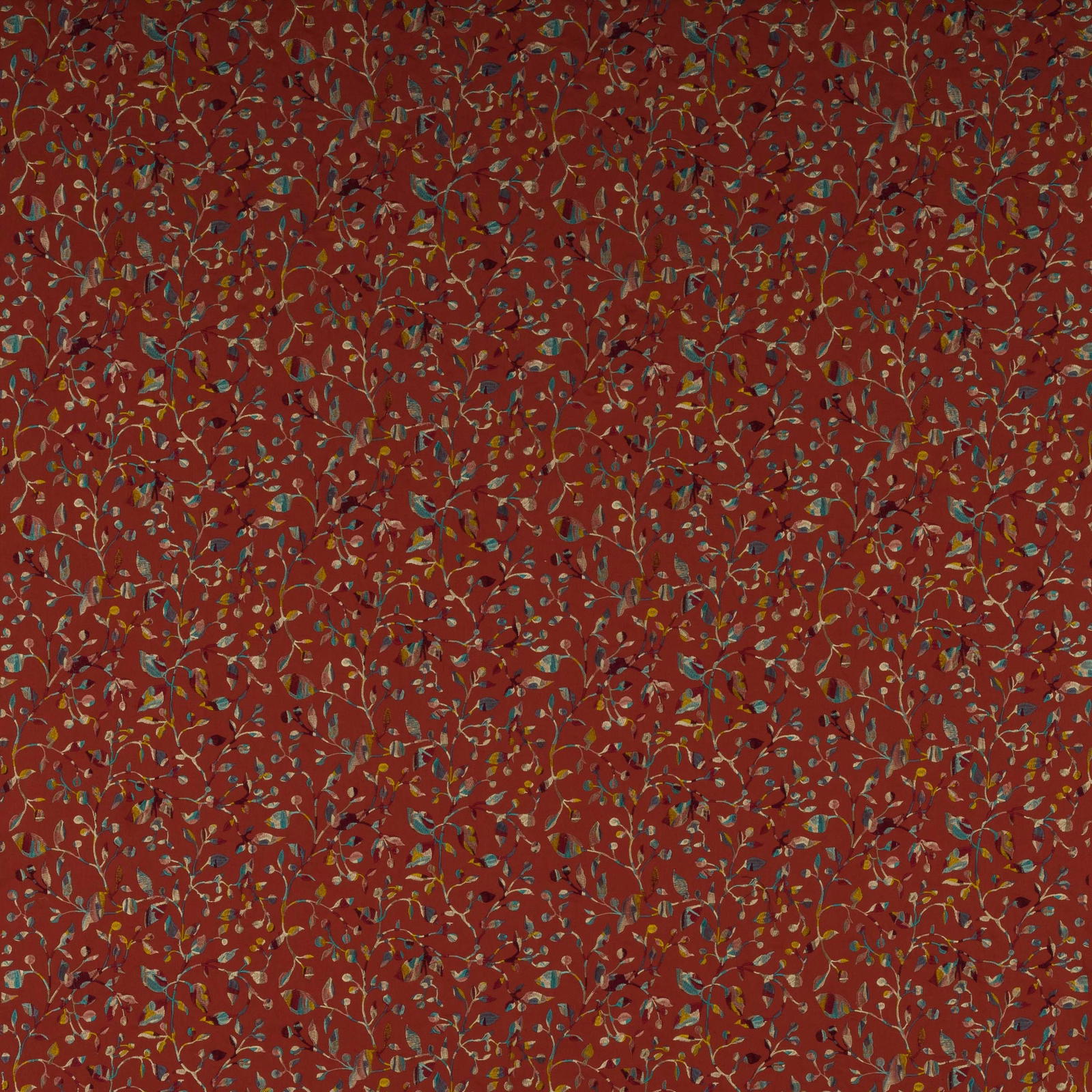 Rust-red botanical fabric with small multicoloured trailing leaves