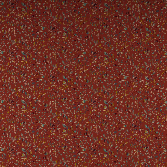 Rust-red botanical fabric with small multicoloured trailing leaves