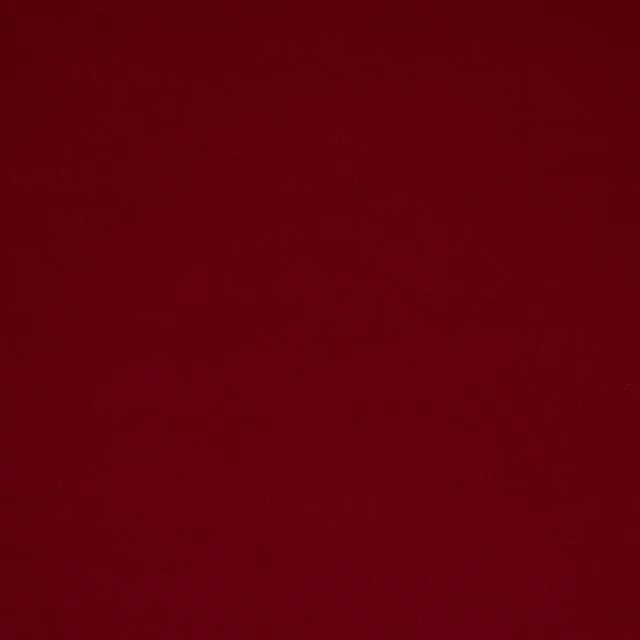Deep amaranth red plain fabric swatch with a smooth, velvety finish
