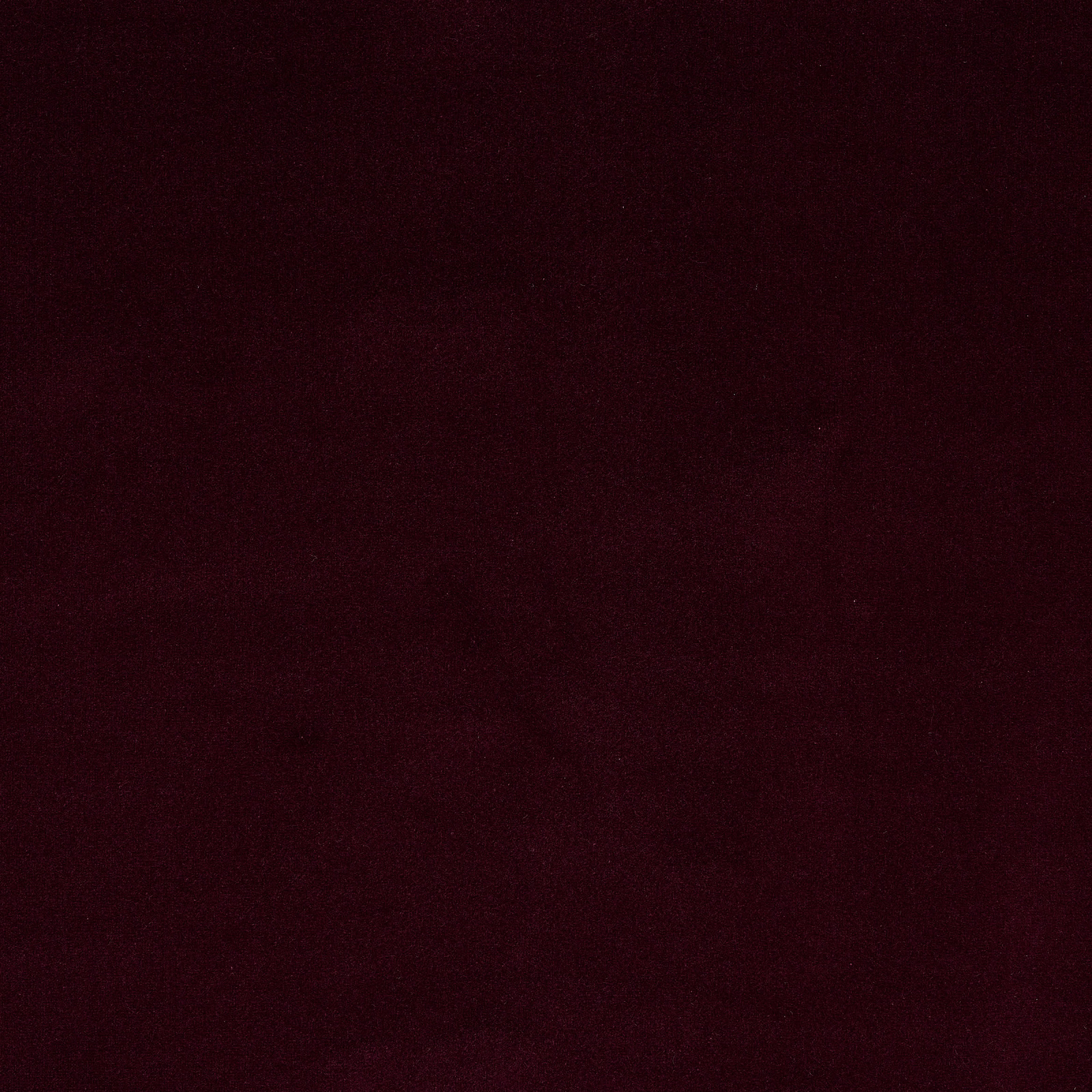 Deep aubergine plum plain fabric swatch with a soft velvety finish