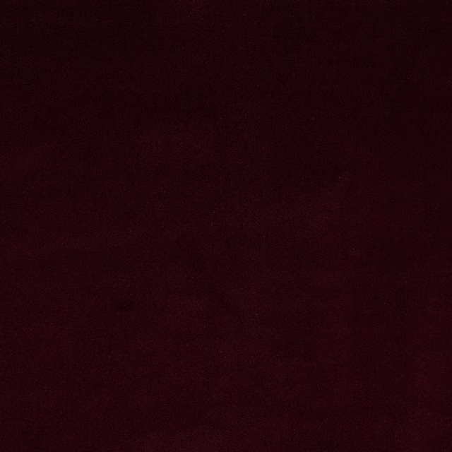 Deep aubergine plum plain fabric swatch with a soft velvety finish
