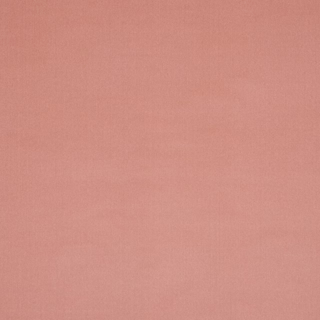 Plain soft blush-pink fabric with a smooth, matte woven surface