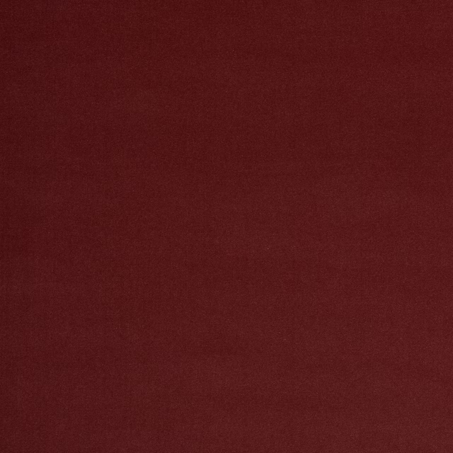Deep brick red plain woven fabric swatch with a fine matte texture