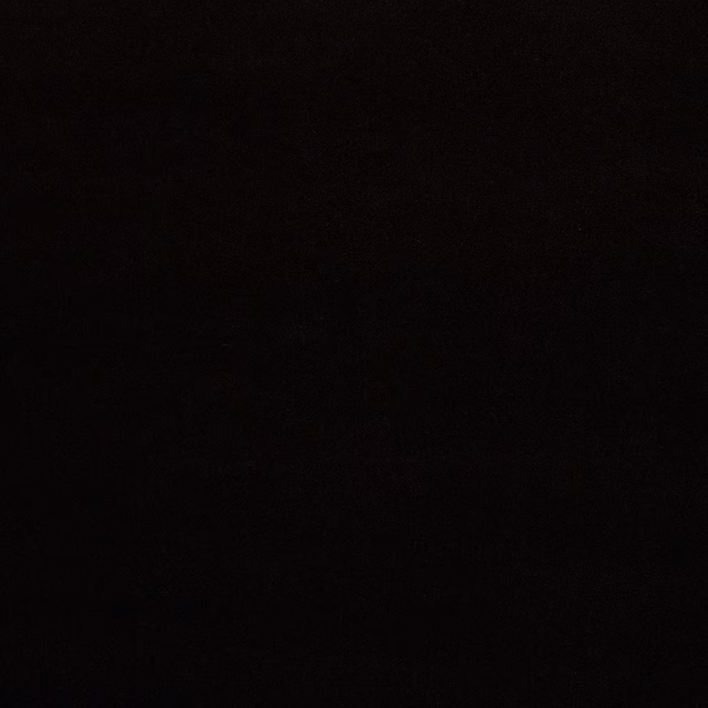 Close-up swatch of very dark chocolate-brown plain fabric with a smooth, matte surface.