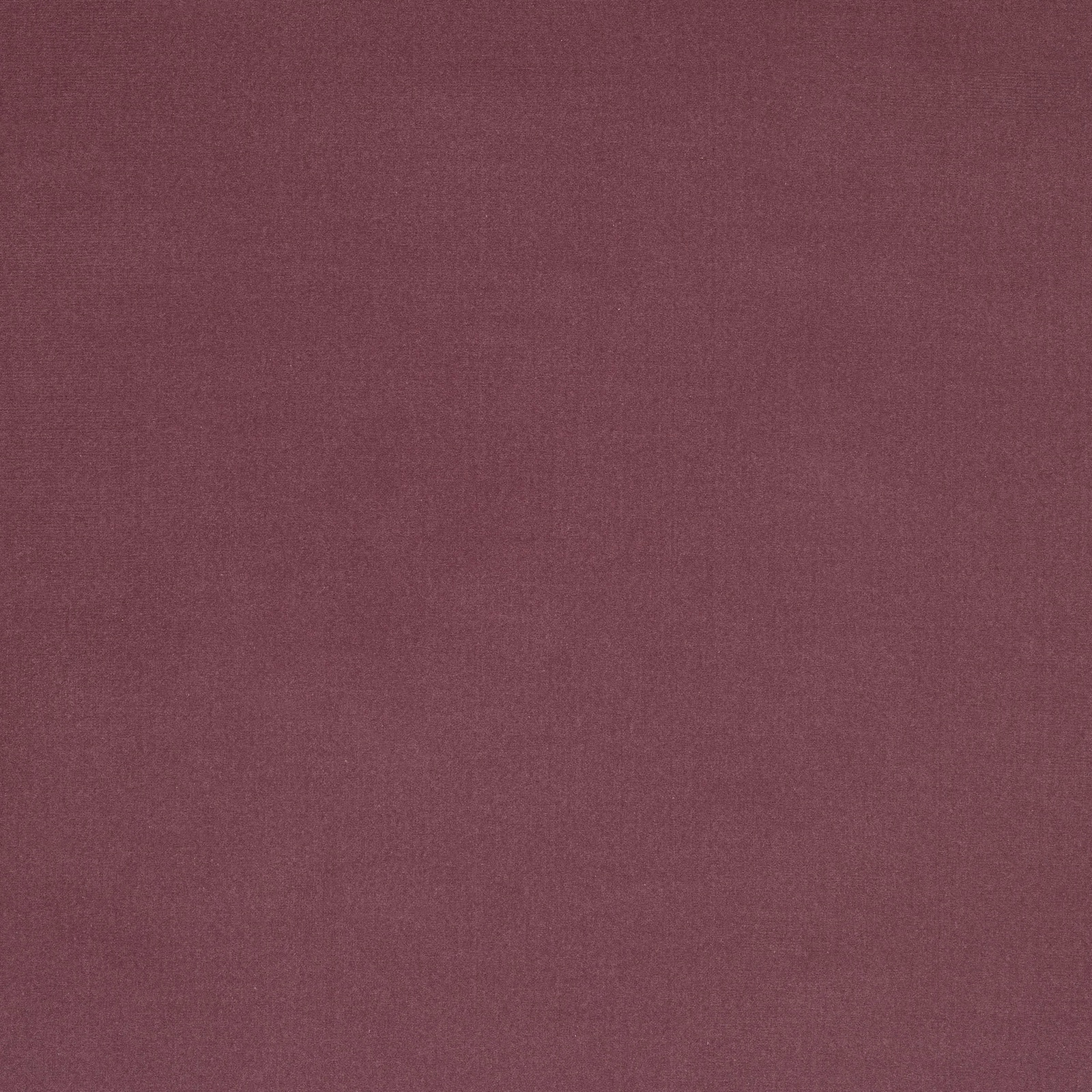 Close-up of a muted plum-mauve plain weave fabric with a smooth finish