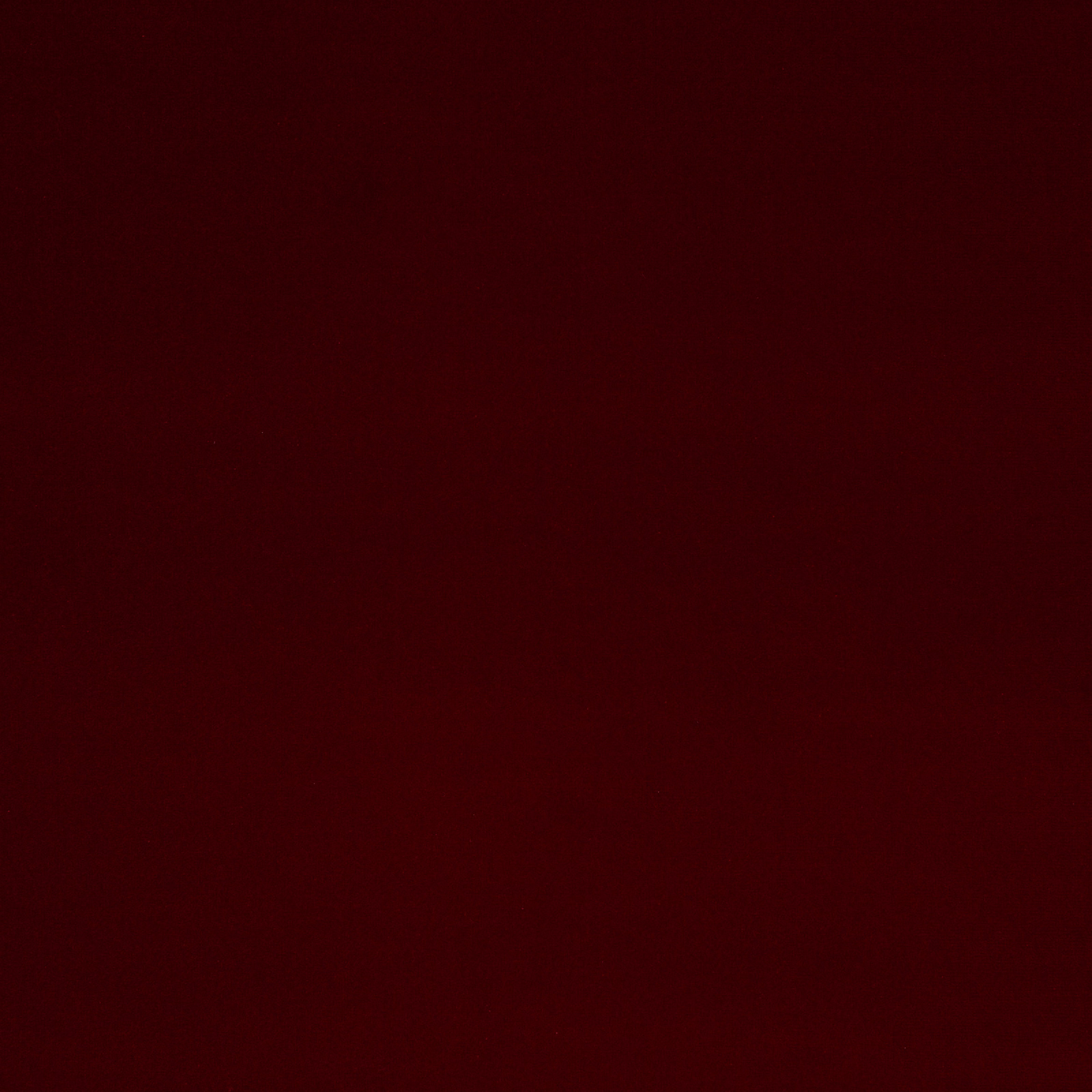 Solid deep oxblood red fabric swatch with a smooth matte finish