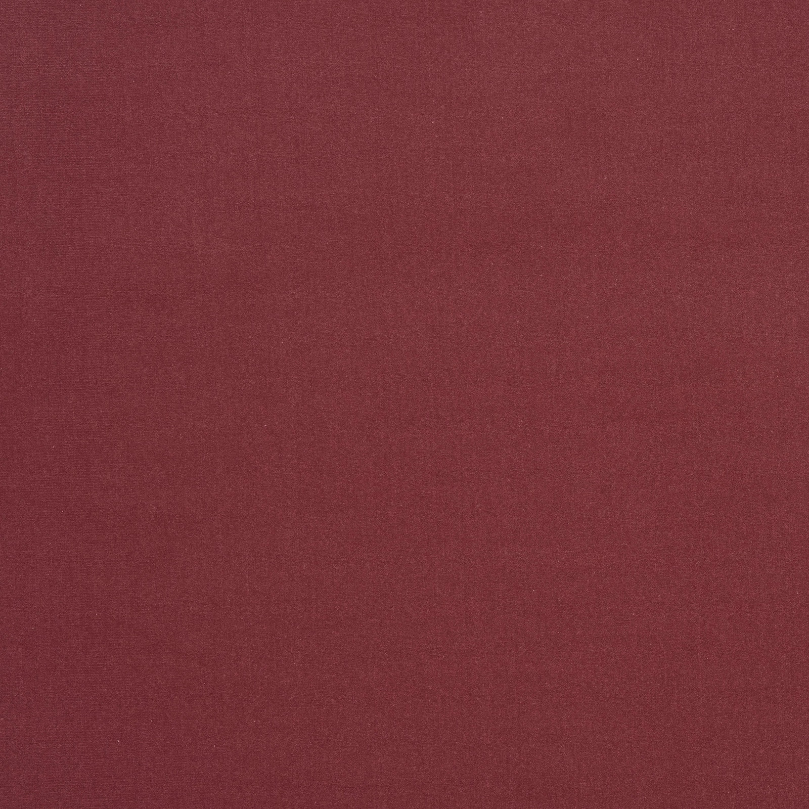 Close-up of muted dusty rose plain-woven fabric with fine texture