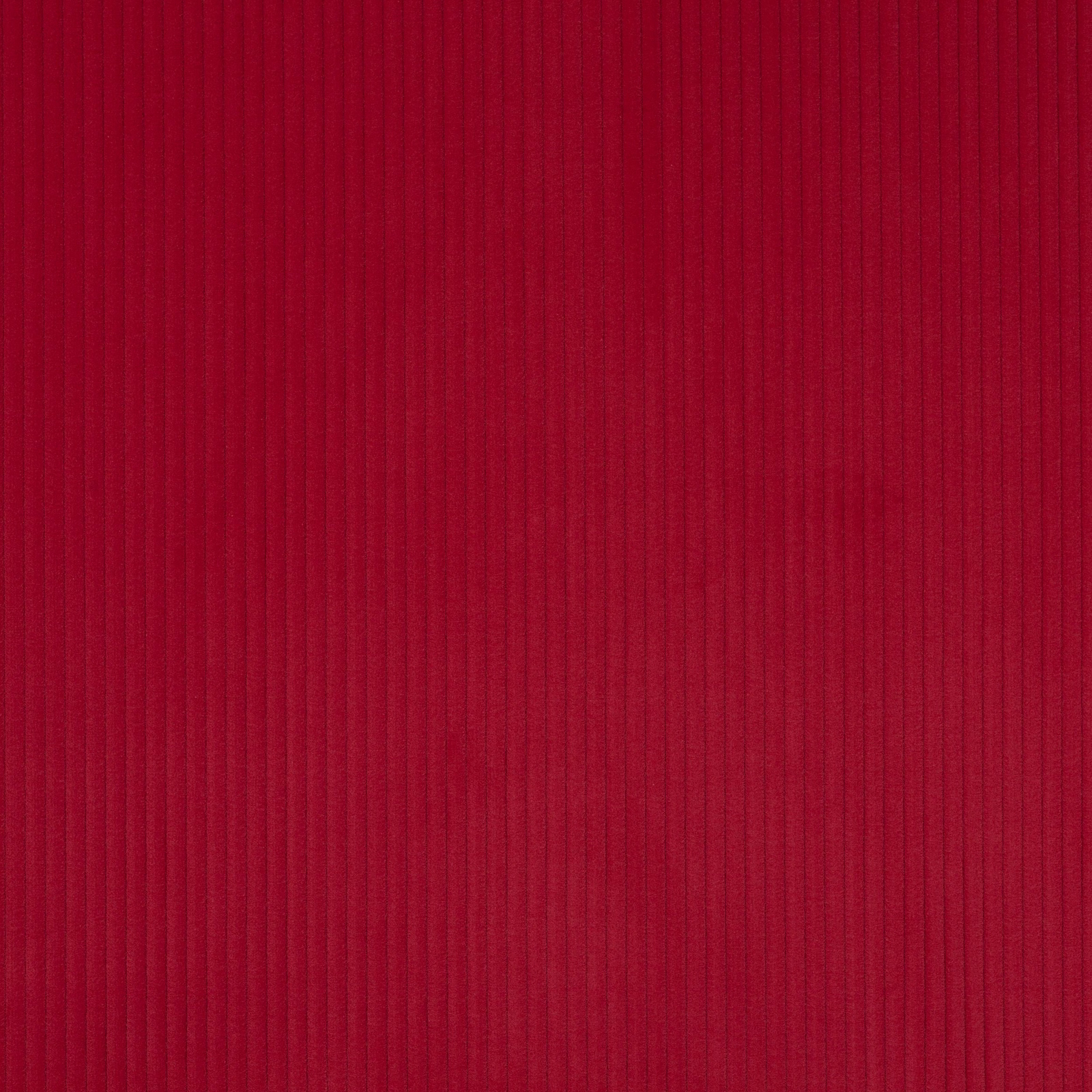 Close-up of deep raspberry red ribbed cotton fabric with fine vertical texture