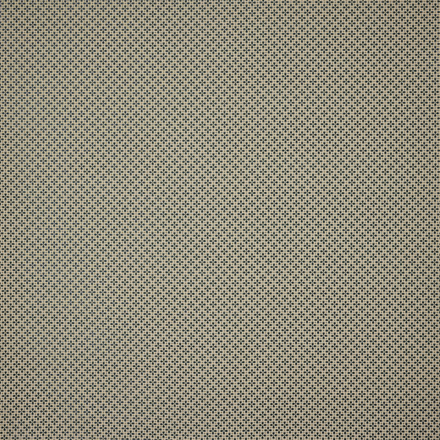 Close-up of a small geometric blue and neutral woven fabric swatch