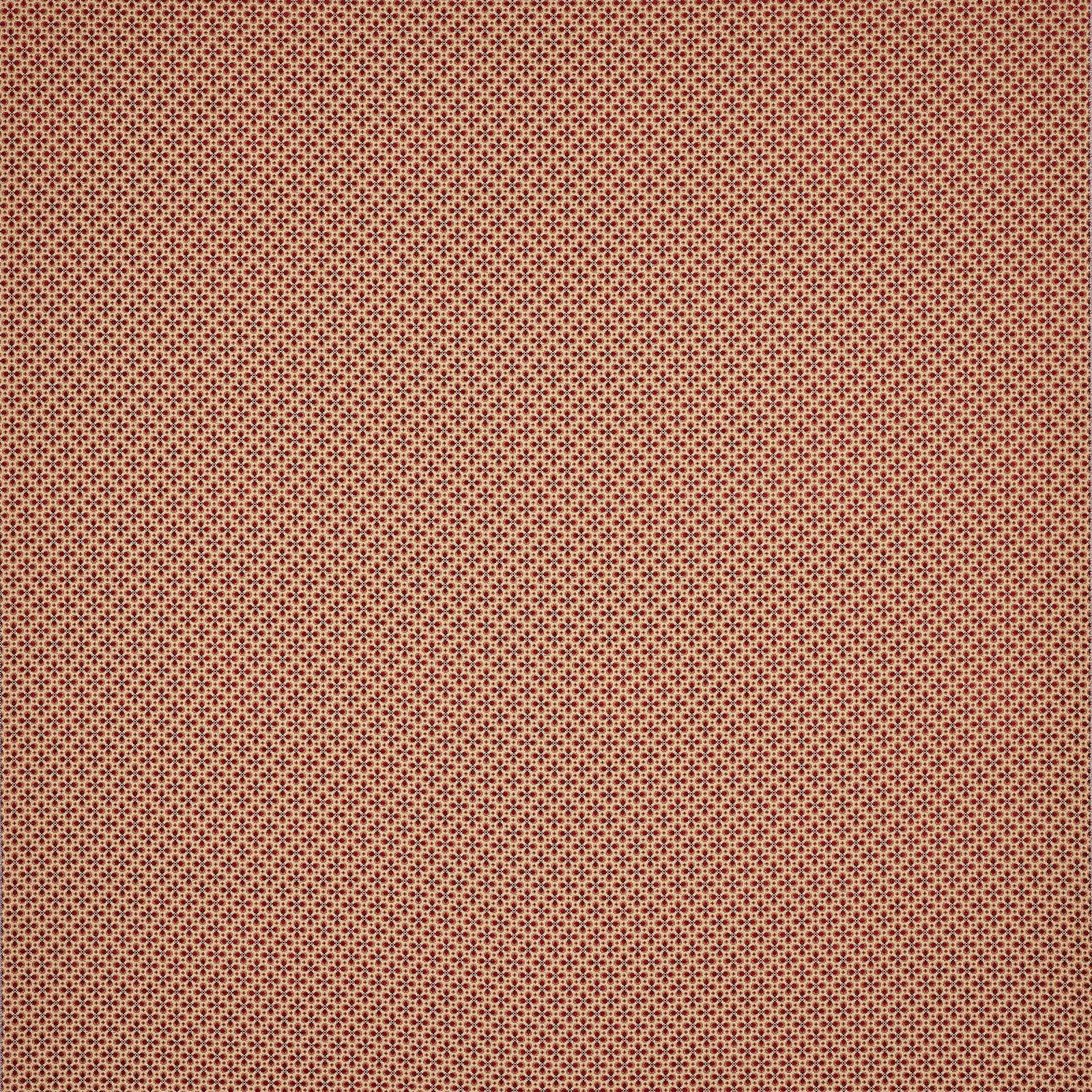 Close-up of tiny repeating terracotta-red woven dots on a textured fabric swatch