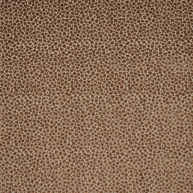 Close-up of beige fabric with dense small sienna-brown spotted pattern