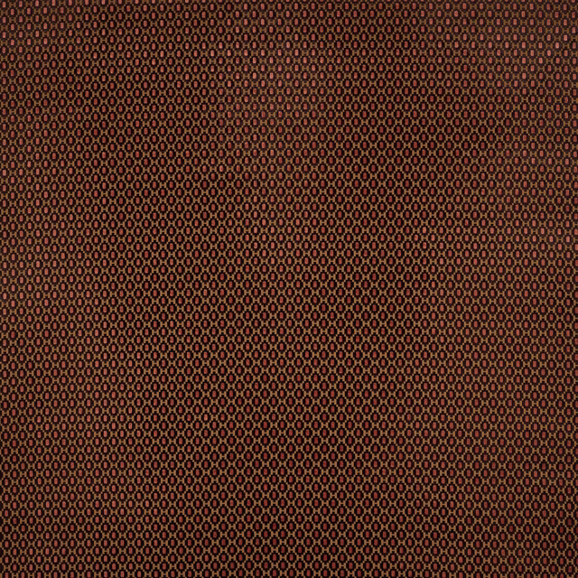 Close-up of small chocolate brown geometric cotton fabric with russet and tan accents