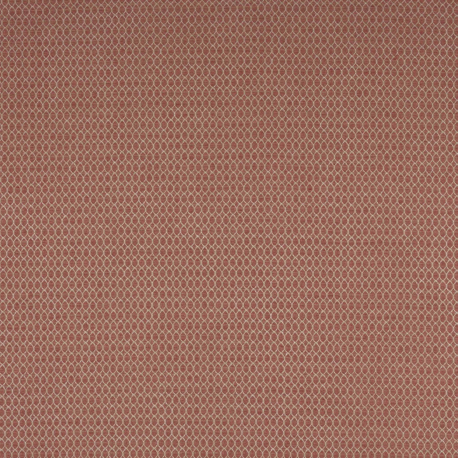 Close-up of a muted terracotta red geometric woven fabric with tiny lattice pattern